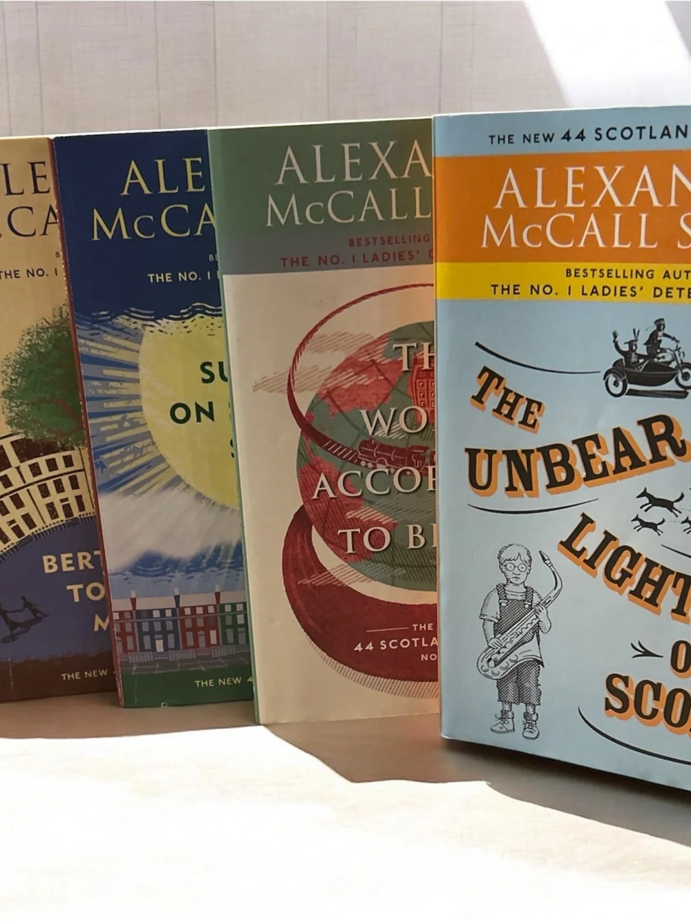 Fictional Drama/Charming/Quirky- Series of books by Alexander McCall Smith